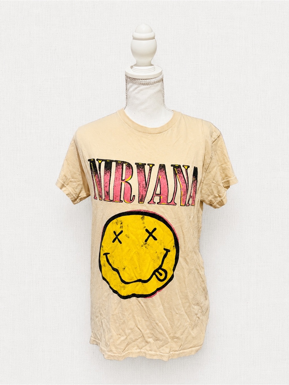 NIRVANA Beige Short-Sleeve Tee with Pink Logo and Yellow Smiley